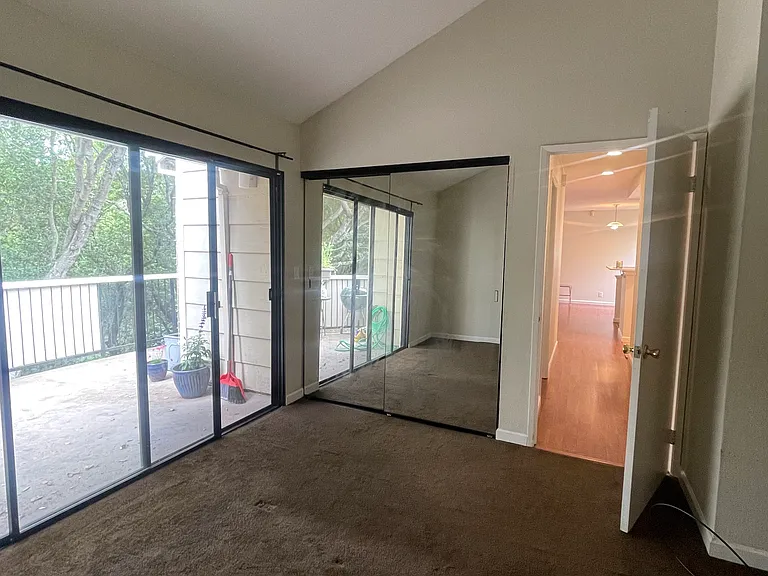 spacious master bedroom, with soaring vaulted ceilings, high-end newly installed closet + storage drawers. wake up to beautiful views, surrounded by trees, and fresh weather. unmatched privacy!