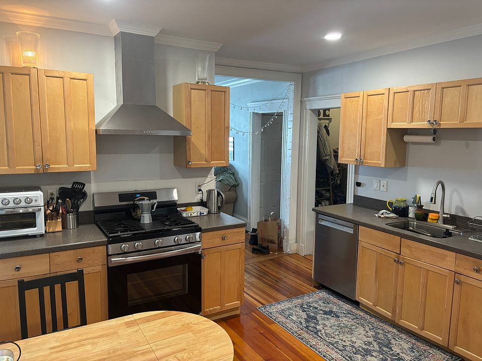 Eat-in kitchen with updated appliances and vented hood