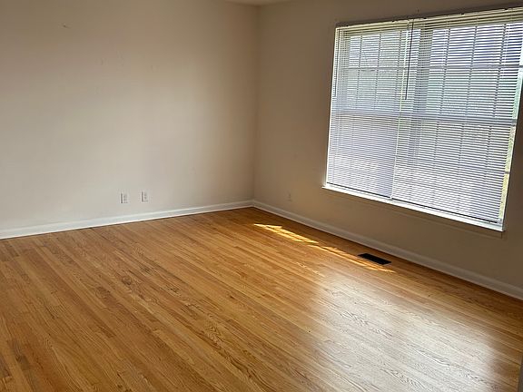 Living room with hardwood flooring.