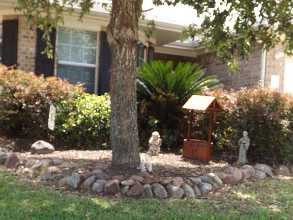 Wonderful landscaping enhances this spacious home