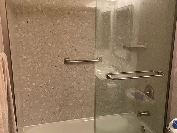 3 full bathrooms, one bedroom and one full bathroom downstairs