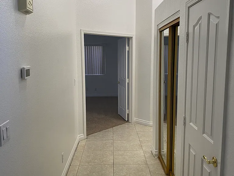 Right of front door - hallway to the bedrooms, pot shelves, vaulted ceilings. Great layout.