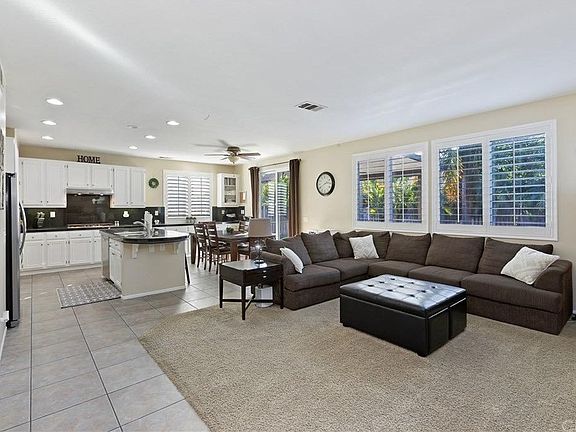 Spacious living room and open kitchen with large island and embedded sink