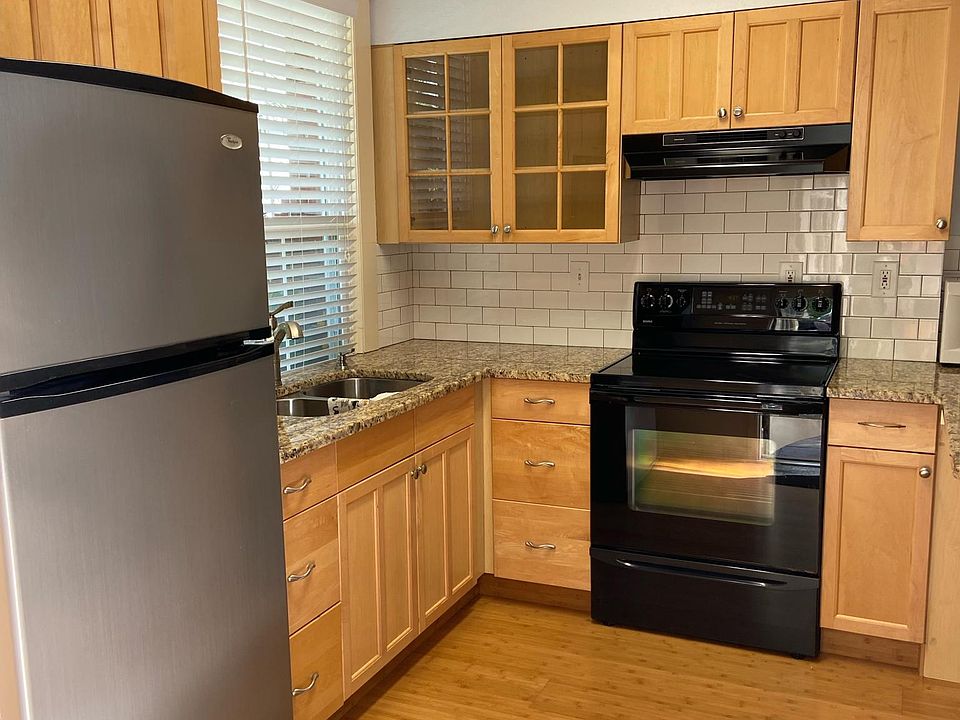 Newer kitchen and appliances with granite countertops.