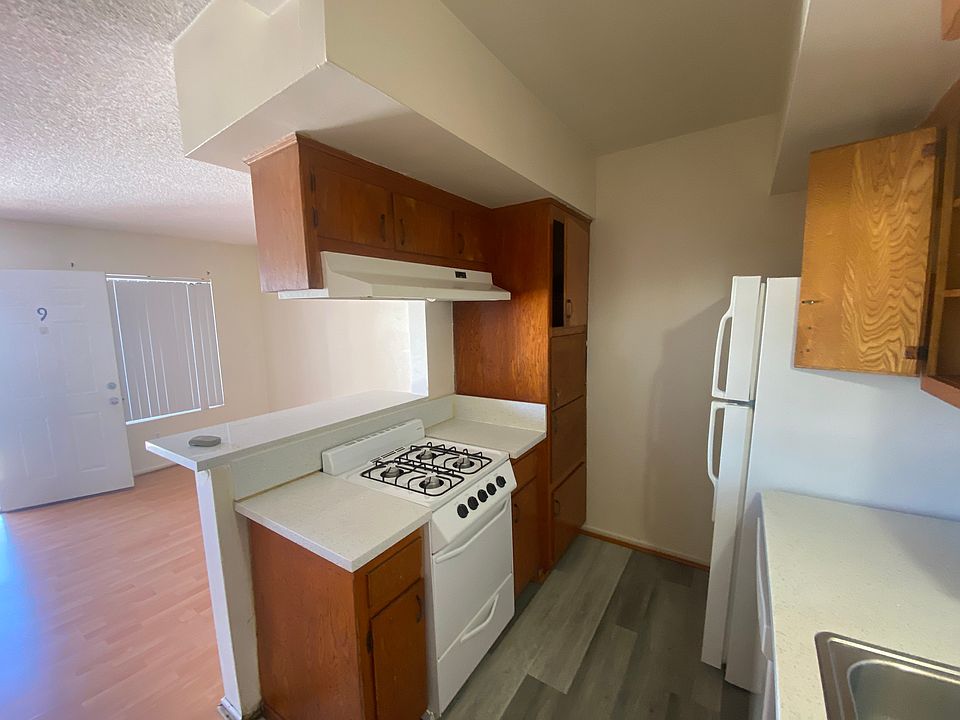 Kitchen with refrigerator, stove and dishwasher.