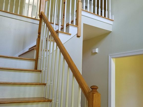 Eye-catching, two-story foyer says you're home; you can relax now.