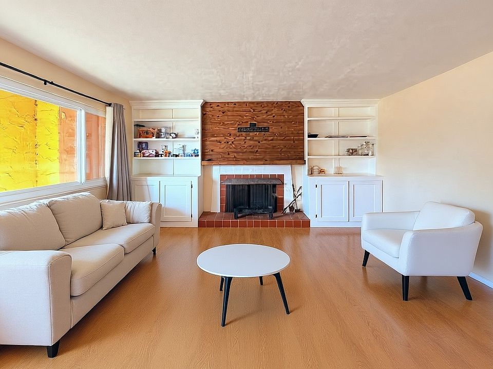 The flooring is scheduled to be replaced with new LVP flooring. The current photo includes temporary staging to help visualize the space while improvements are being completed.