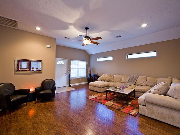This view of the living room shows how large this area is! Pretty floors, fresh paint thru-out and n