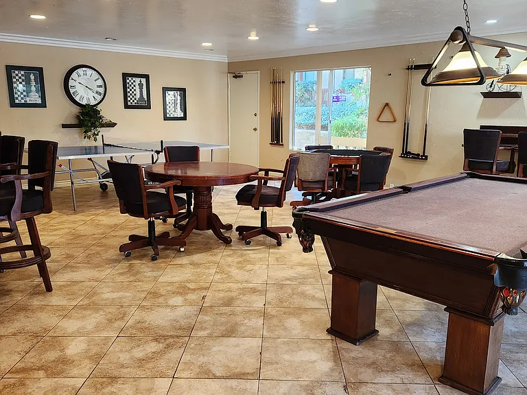 Game room with pool table, poker table, ping-pong table, dart board, and plenty of seating!