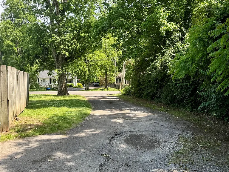 Private drive around back with off street parking.