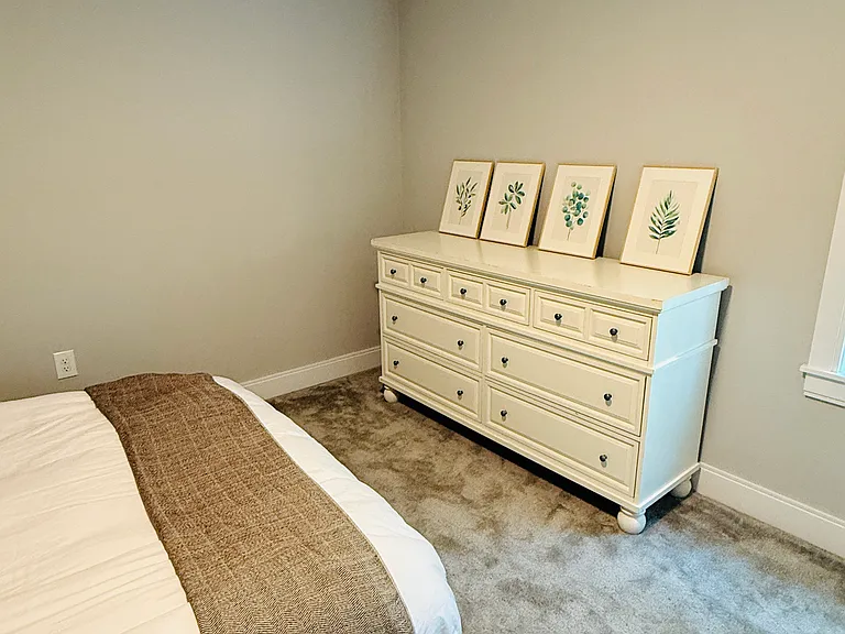 Bedroom with dresser. And paintings to be hung soon.
