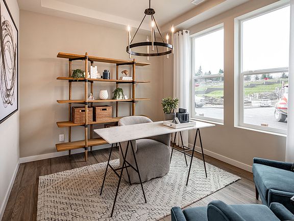The Brinnon floorplan featuring a spacious den with large windows to illuminate the space.