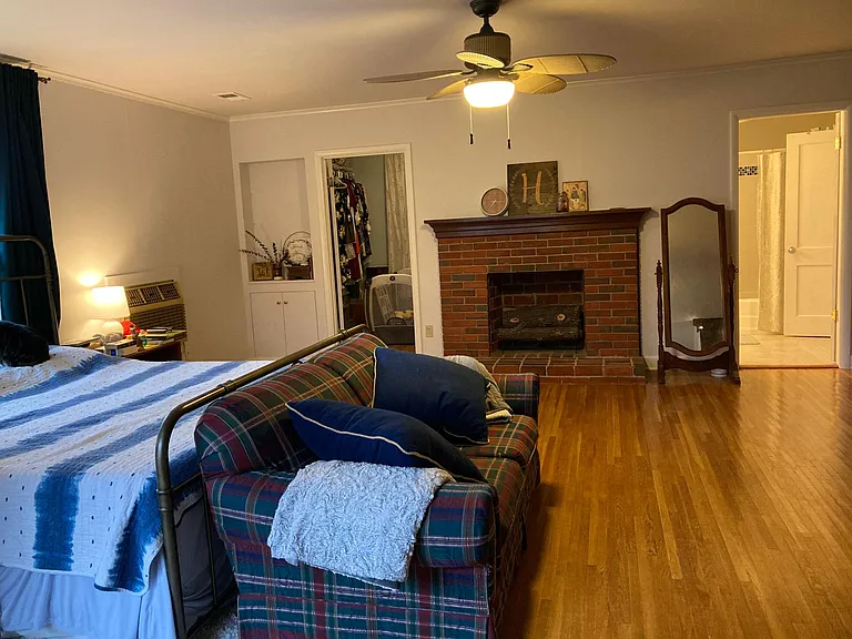 master bedroom with walk-in closet and full bathroom