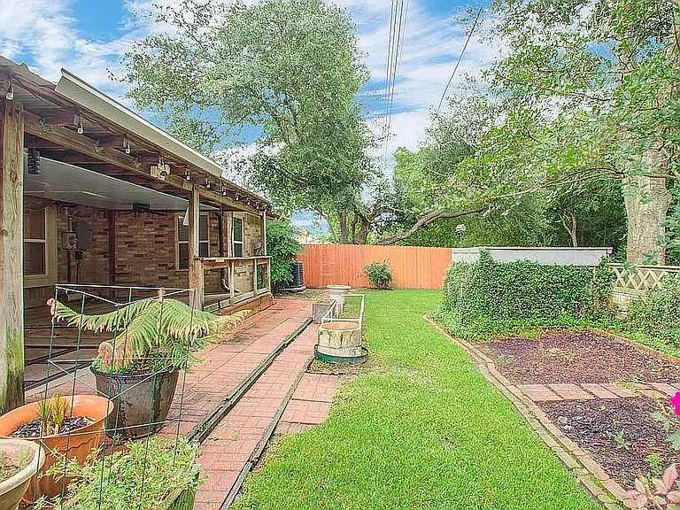 Private fenced backyard with plenty of room for kids, pets, or entertaining.