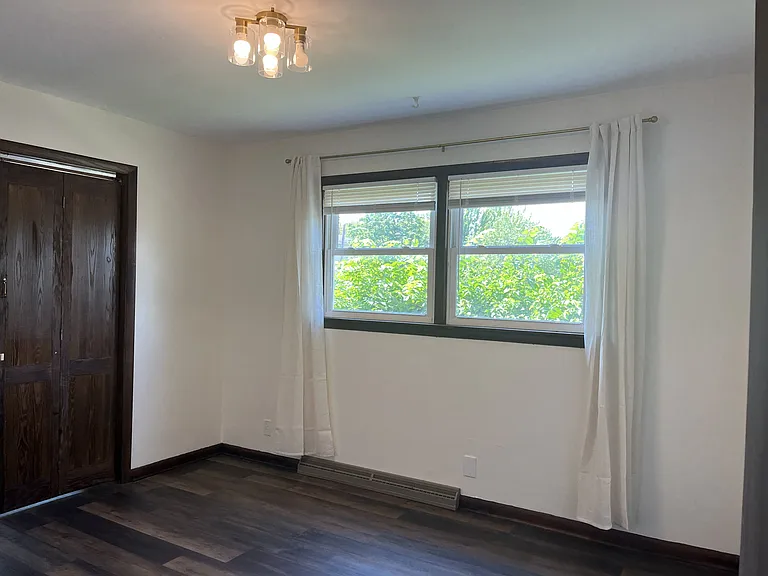 3rd Bedroom. Amazing sunset views! Perfect for sleep or turn it into a dream bonus room that could be used for play, crafts, gaming, or an office.