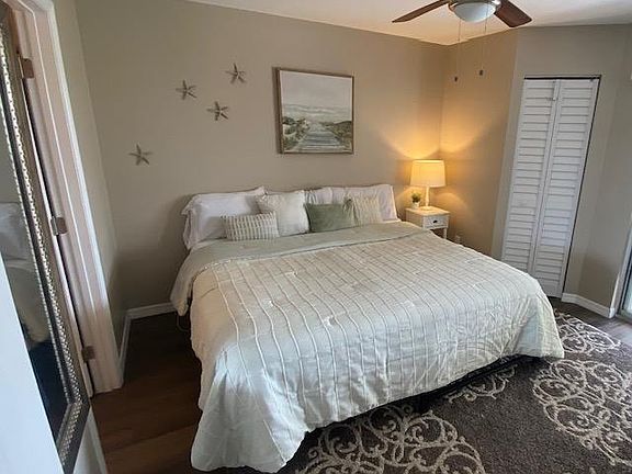 Primary has full walk in closet with plenty of drawer storage, hanging racks and comfortable bed.