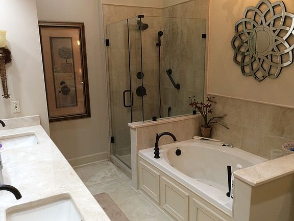 Master bath
						:
						Marble countertops, glass shower, water closet, his/hers sinks, air bubble tub