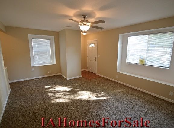 Large family room with new flooring, lighting and cieling fan
