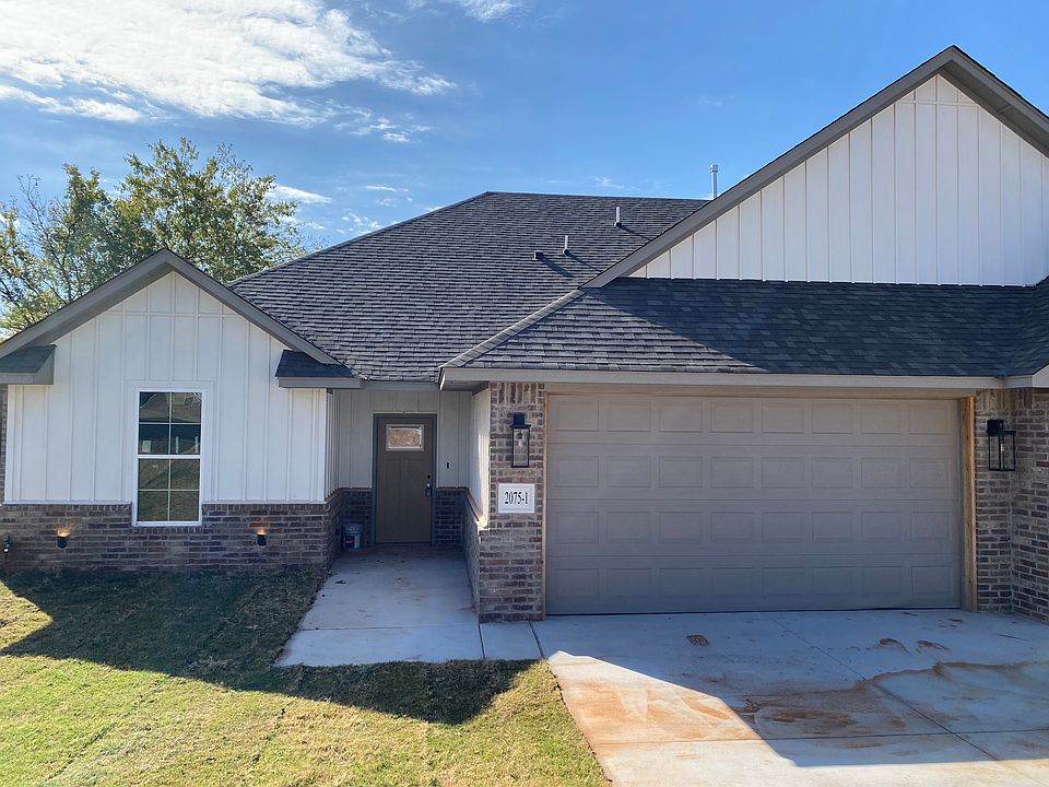 Front of unit with 2 car garage