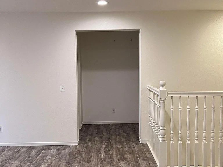 View of laundry room and master bedroom