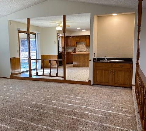 Great room open to roomy kitchen, island and lots of cabinetry