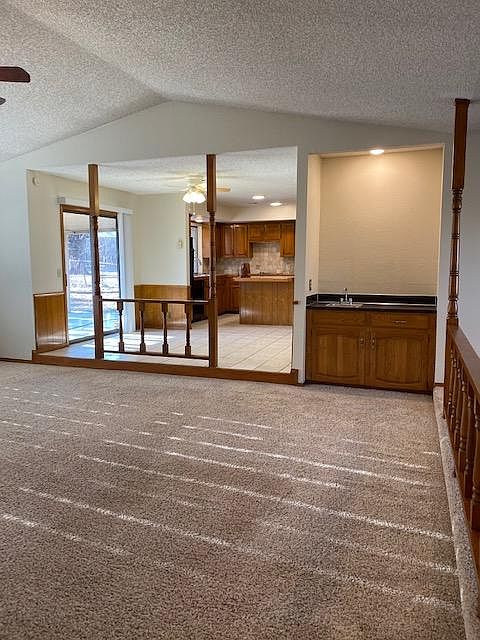 Great room open to roomy kitchen, island and lots of cabinetry