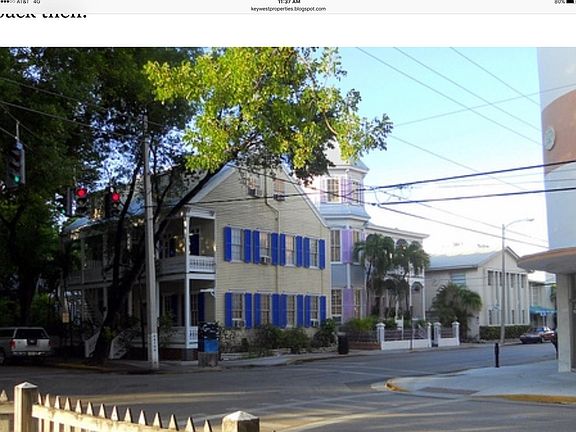 Side view of 400 Simonton Street. Studios of Key West/Books & Books on corner to right. The Artist House B&B/Guesthouse is depicted to the right of 400 Simonton Street.