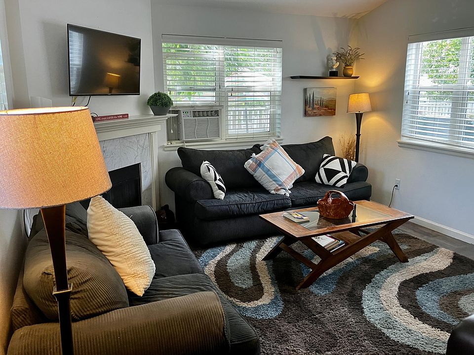 Our living area has great natural sunlight, a couch, love seat and a wonderful leather recliner