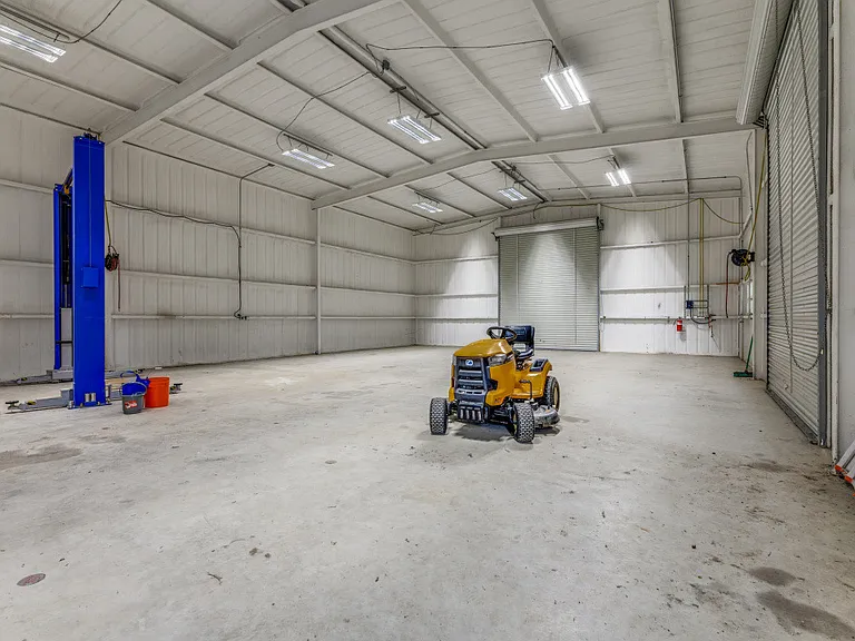 Inside option shop space with car lift