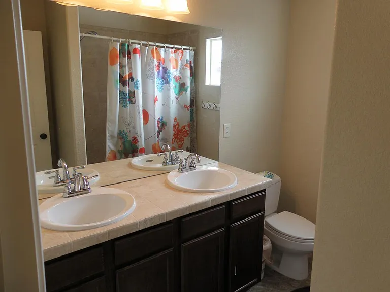 Upper floor main bathroom with double vanity
