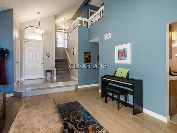 Family room looking towards kitchen & second level.  Note vaulted ceilings.
