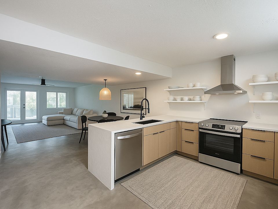 Virtually staged Lower Level - kitchen, dining, and living rooms.