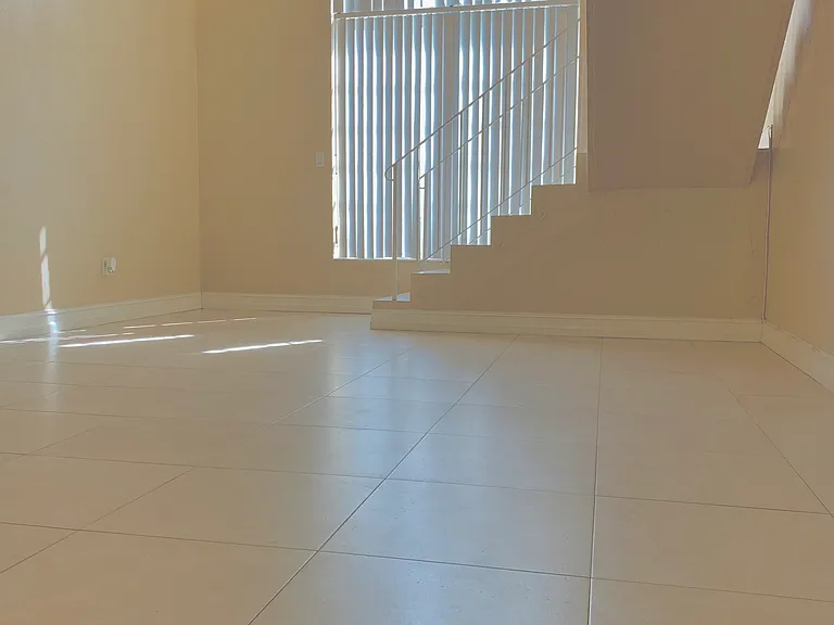 Spacious Open-Concept Loft-Style Greatroom that combines an inviting Living and Dining area, exuding elegance and comfort while maximizing natural light.