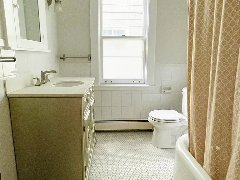 Bathroom with tub and shower.