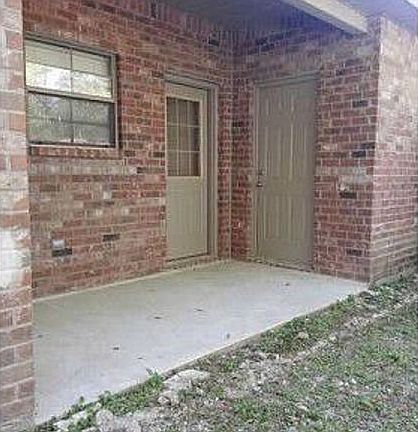 Back of unit w/storage shed
