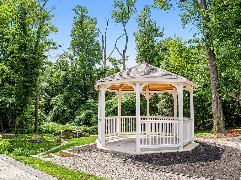 Relax in this charming gazebo, nestled in a picturesque garden setting.