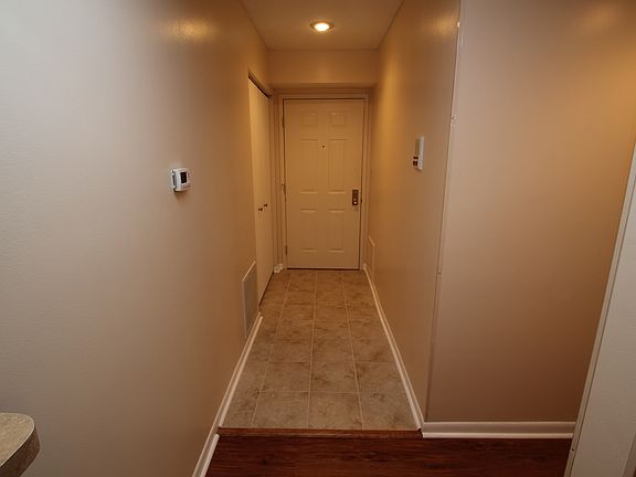 Enry way leads to newly installed laminate wood flooring