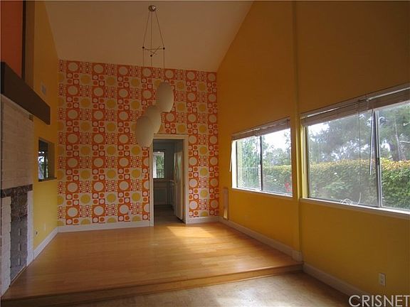 Dining room, sunny, large windows.