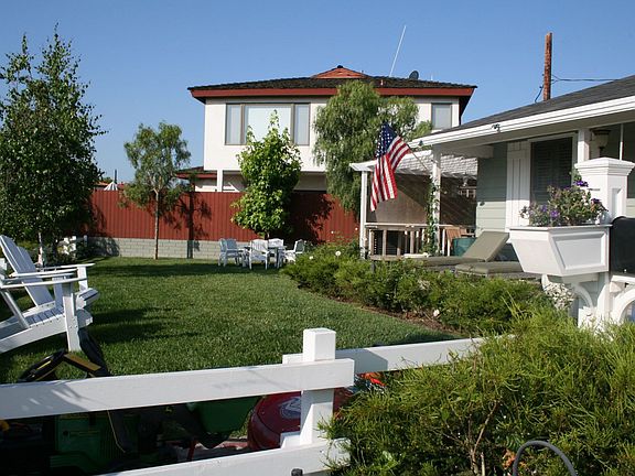 View of the yard and house from the driveway