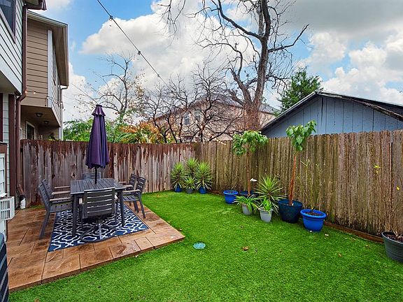 Beautiful backyard with patio, garden and lawn space