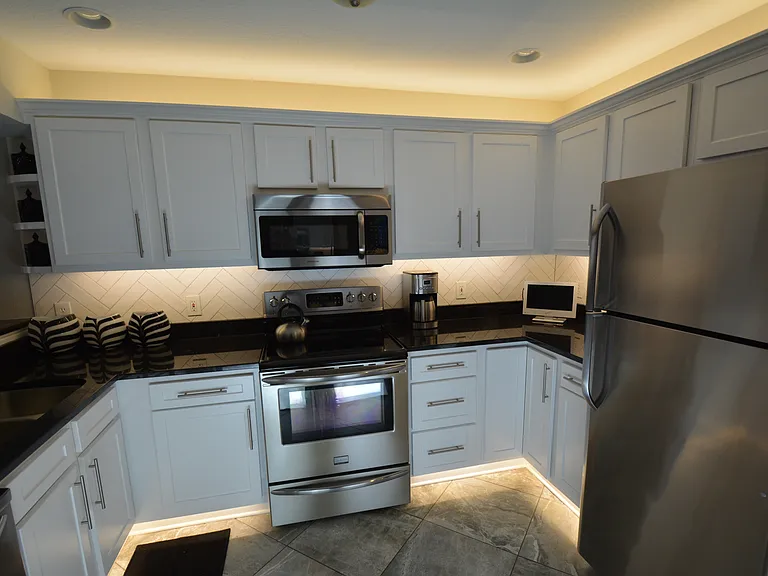 Select kitchens have tile backsplash and under & over cabinet lighting