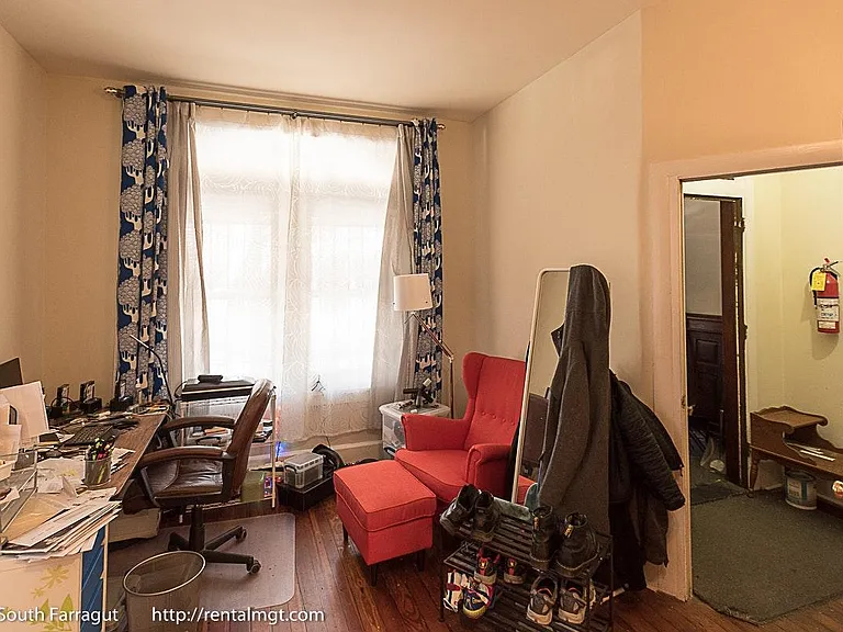 Living room and foyer view (with tenant's furrniture)