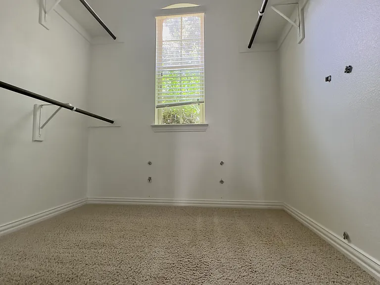 Master bedroom Walk-in closet 1 with a window