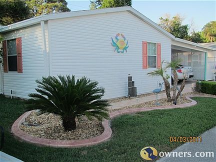 Newly refinhed front view of home w/pavers and curbing