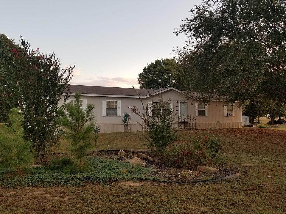 Front of home and flower garden