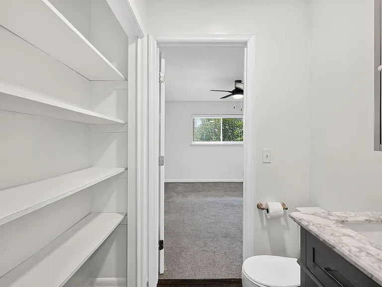 Jack N Jill Half Bath located between bedroom 1 and kitchen.