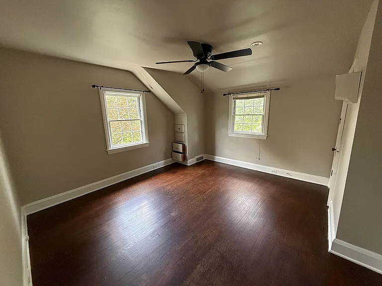 Second bedroom facing the back yard. Window AC.