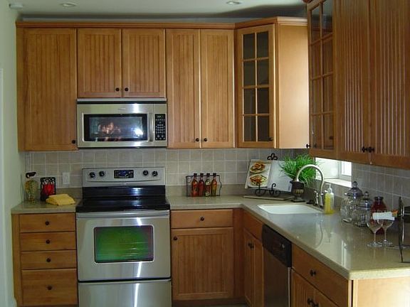 Kitchen with Corian Counter and Ceramic Tile Floor