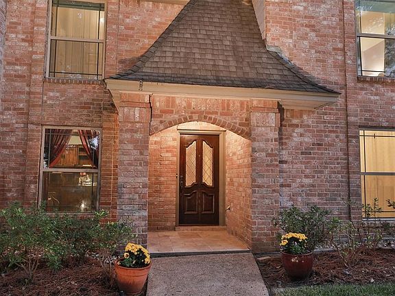 ALL BRICK HOME WITH NEW HARDI-PLANK DOUBLE PANE WINDOWS AND A COVERED ENTRY - The outdoor entry floor is beautiful Travertine...