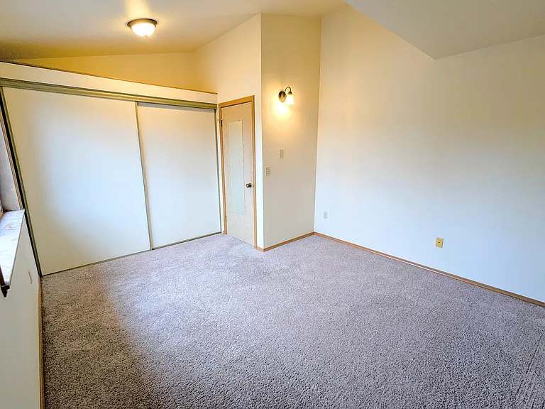 209 Primary bedroom with storage above enormous closet